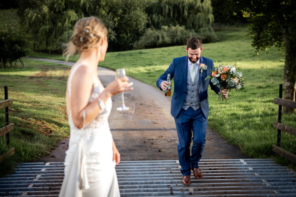 Groom walks over a cattle grid at Bredenbury Court.