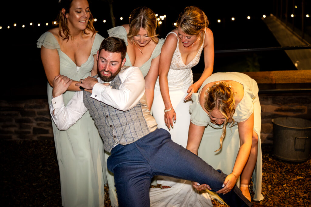 Bride and bridesmaids picking up the groom.