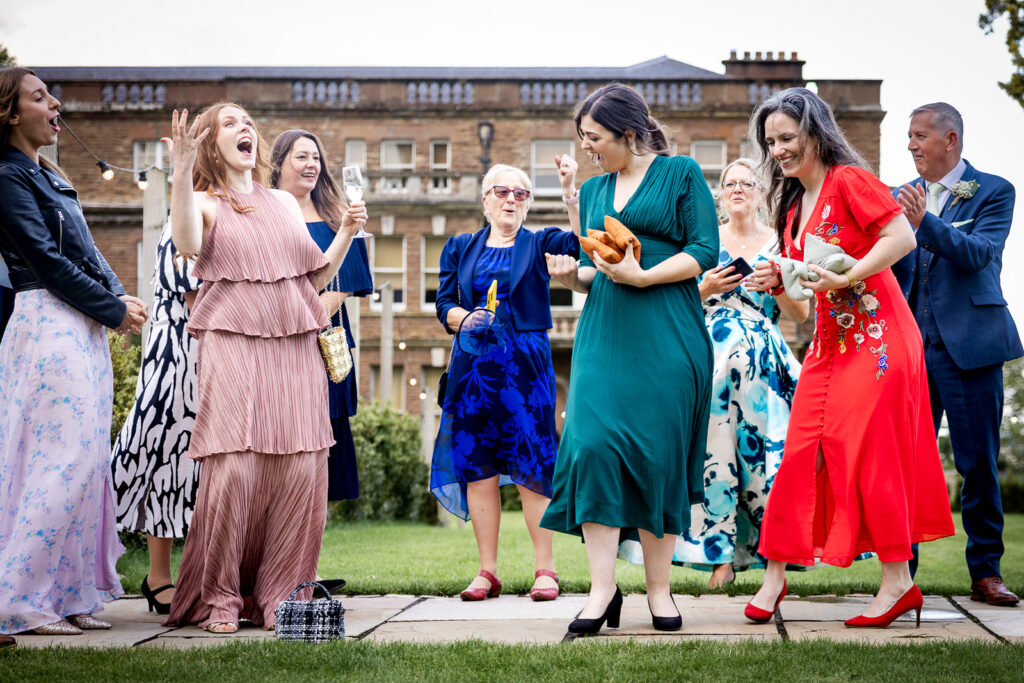 Guests enjoying lawn games at a Bredenbury Court wedding.