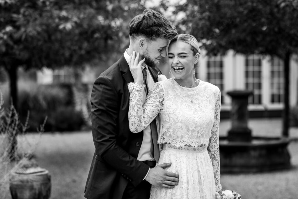 Laughing bride and groom.