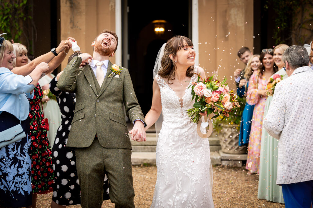 A fun confetti line shot at a Nurstead Court wedding.