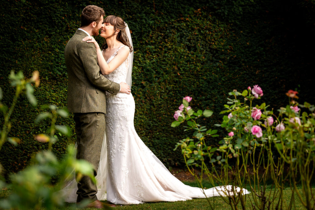 A bride and groom kissing at Nurstead Court.