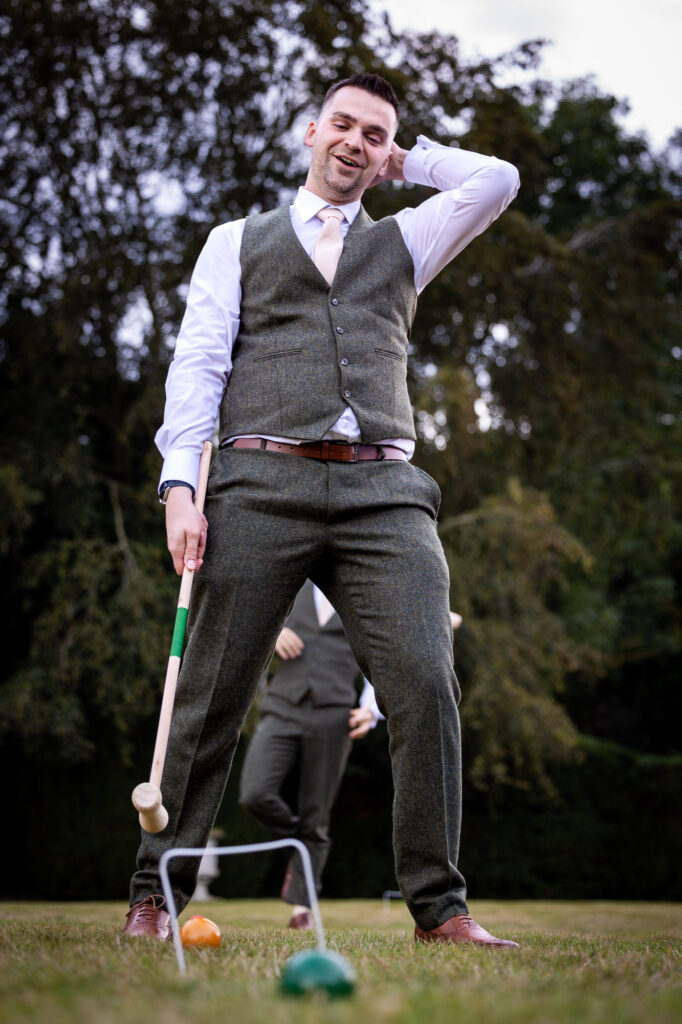 Best man playing croquet.