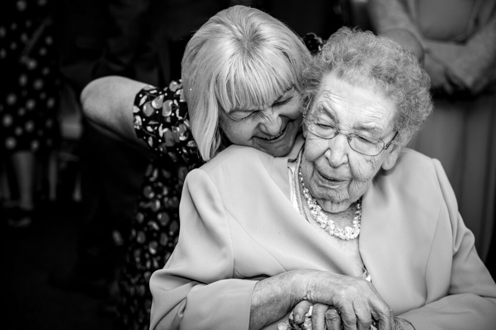 Wedding guests laughing.