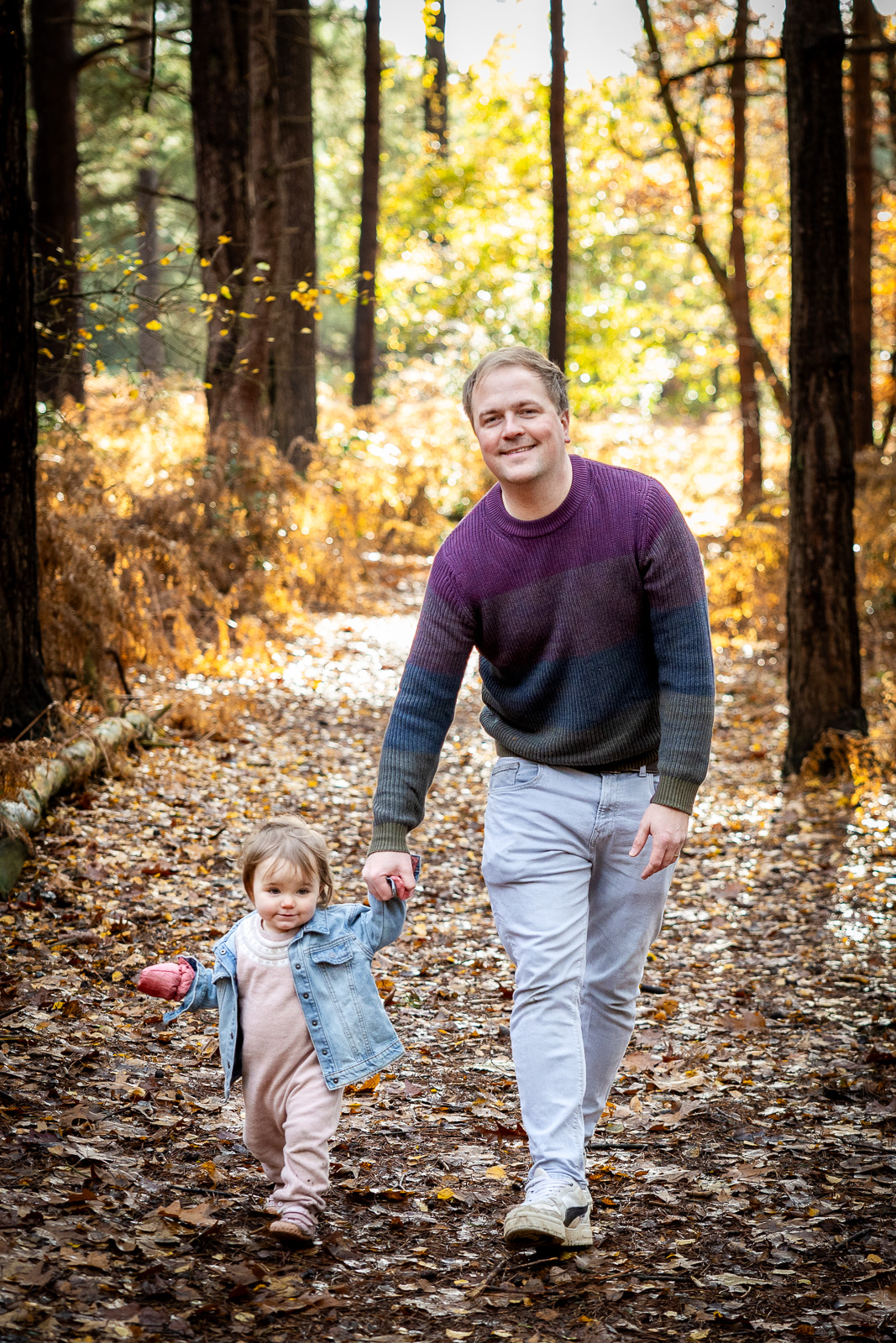 Ashley Morton with his daughter in the woods.